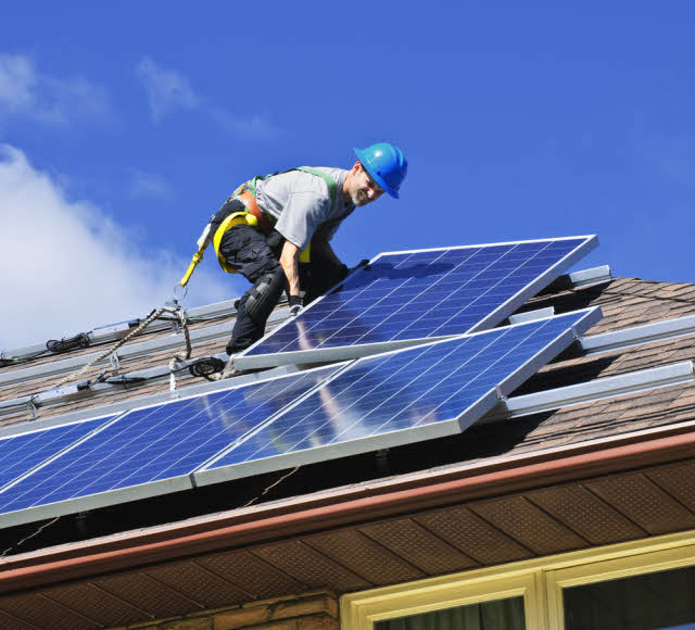 installing solar panels on a roof